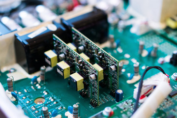 Resistors, capacitors and other electronic components of micro chip inside the computer close up