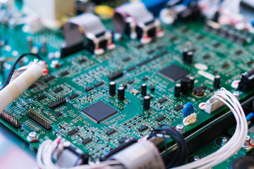Resistors, capacitors and other electronic components of micro chip inside the computer close up