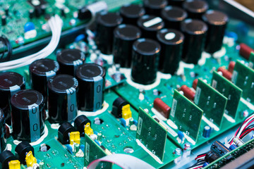 Resistors, capacitors and other electronic components of micro chip inside the computer close up