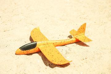 Bright orange toy foam airplane