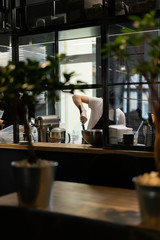 Master chef prepares a sweet dessert for the production of sweets. Mixing dough and cream for the cake in a deep bowl.
