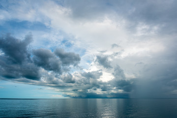Storm clouds and rain over tropical ocean Australia