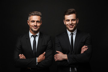 Two confident handsome businessmen wearing suit
