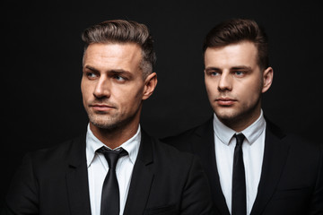 Two confident handsome businessmen wearing suit