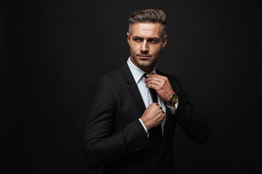 Handsome confident businessman wearing suit