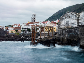 Marine panorama of the ocean coast. Mountains, rocks, clouds and waves with soft light. Tenerife...