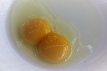 Egg double yolk on a plate.