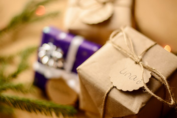 Christmas composition. Many gift boxes near the christmas tree with a blurred background