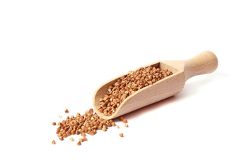 raw buckwheat isolated on white.
