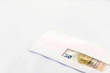 Letter envelope with money inside on white background