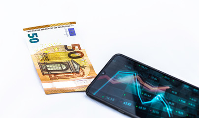 Smartphone with graphics and € 50 bill on white background