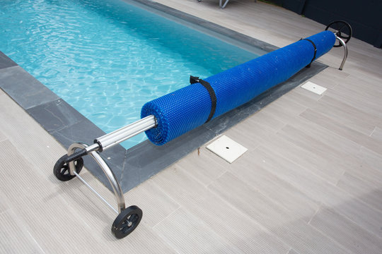 Swimming pool steel blue bubble solar winder detail for protection and heat the water