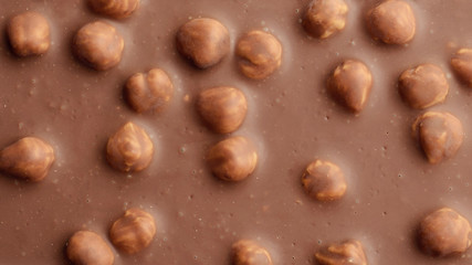 Chocolate background with hazelnuts