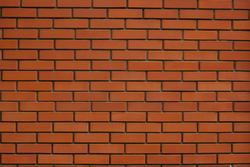 Naklejka premium Red monochrome brick wall texture background 