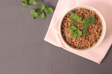 boiled buckwheat in a plate on the table.
