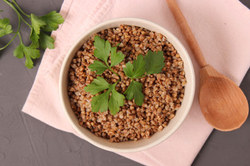 boiled buckwheat in a plate on the table.