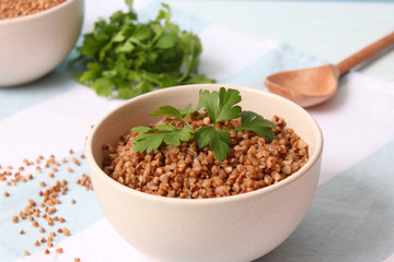 boiled buckwheat in a plate on the table.
