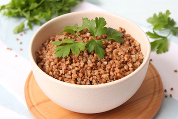 boiled buckwheat in a plate on the table.