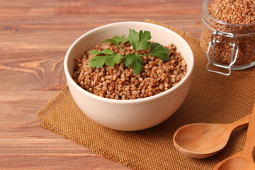 boiled buckwheat in a plate on the table.