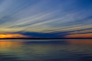 Fototapeta na wymiar elongated feather clouds at sunset