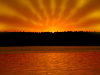 Orange light with sun rays and dark forest on river