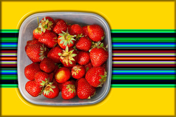Strawberries in a square plastic tray on a beautiful background with copy space