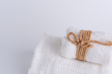 Obraz na płótnie Canvas Rolled white towels spa object on white background