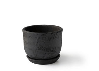 Hand made black clay pot isolated on white background