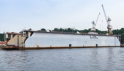 Floating dry dock with ship inside