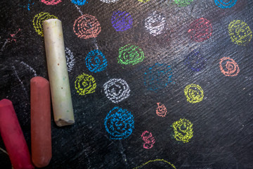 Multicolored circles are drawn with chalk
