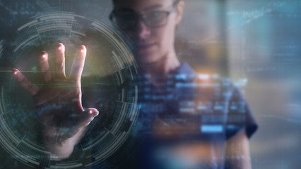 Portrait of an young man is using the futuristic latest innovation technology with augmented...