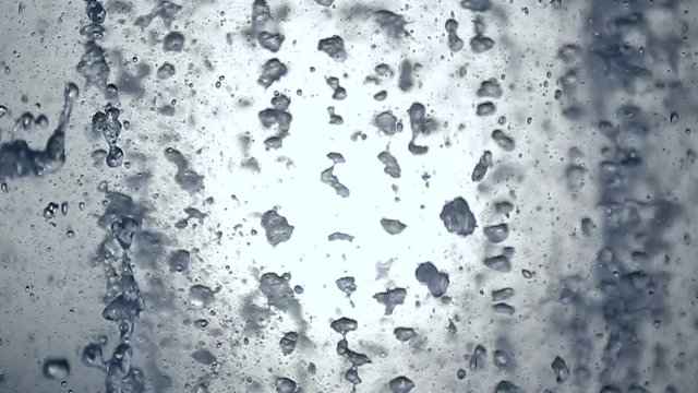 Water drops are pouring the background