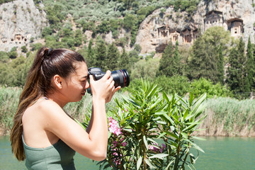 beautiful young photographer taking a photo