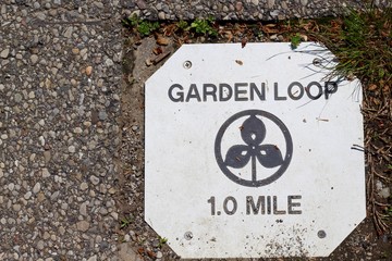 A close view of the trail distance marker on the path.