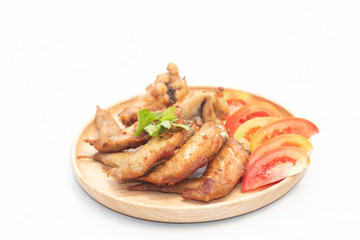 Fried chicken wings to serve to customers in the restaurant on white isolated background. Good quality products that are fresh and safe. Online food order concept.