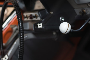 A dash mounted gear stick on a classic car.