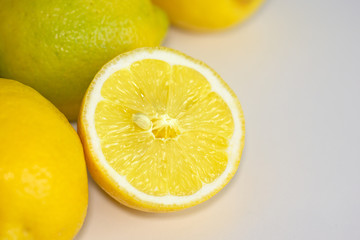 Fototapeta na wymiar Freshly sun drenched lemons, on background Bokeh.
