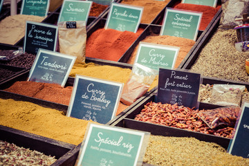 French colorful herb and spices at street market in the village in Provence, France.