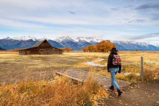 Woman at Mormon Row and Teton Range, Grand Teton National Park, Wyoming