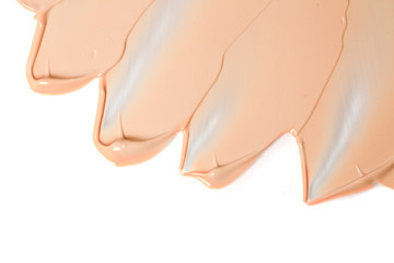 Close up of face liquid foundation texture. Cosmetic background isolated on white