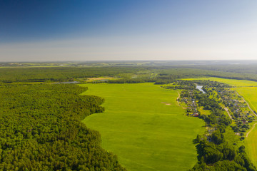 Aerial View of Cottage village among forest at summer sunny day, Moscow area, Russia