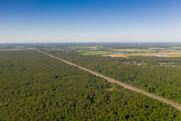 Aerial view of summer green rural road in Moscow area, Russia