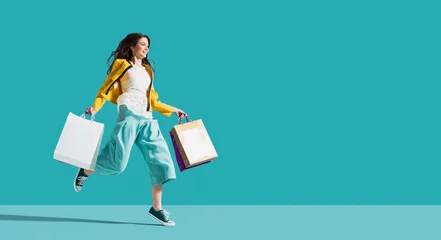 Foto op Plexiglas Cheerful happy woman enjoying shopping © stokkete
