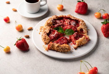 strawberry cookie, on a white plate on a marble backdrop, summer dessert