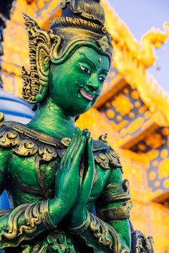 Green Yaksha statue at Wat Rong Suea Ten (Blue Temple) in Chiang Rai