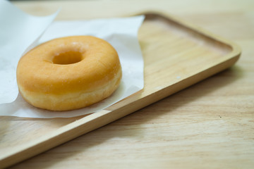 Classic donut on wood tray