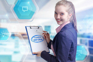 Business, technology, internet and networking concept. Young entrepreneur showing keyword: taxes...