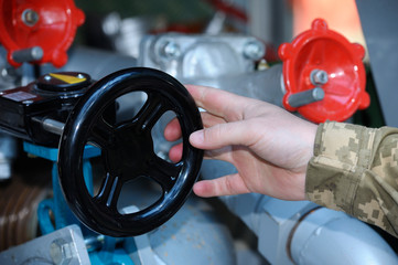 Fireman’s hand turning valve of water pump  