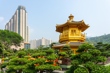 Fototapeta na wymiar The Golden pavilion and gold bridge in Nan Lian Garden near Chi Lin Nunnery. A public chinese classical park in Diamond Hill, Kowloon in Hong Kong city