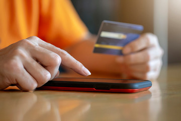 Shopping online payment with credit card , man using mobile smartphone ,  business e-commerce and application concept